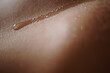 Closeup shot of details on sunburnt human skin with dripping sweat