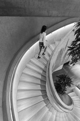 Poster - Modern interior view of spiral staircase, viewed from top