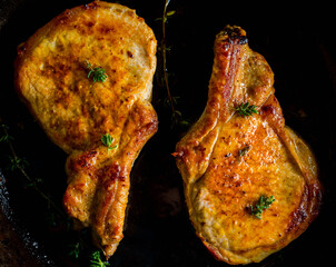 Wall Mural - Roasted pork meat in the skillet. Selective focus. Shallow depth of field.