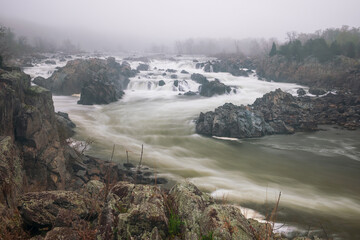 Wall Mural - View of the Great Falls of the Potomac River on a foggy spring morning.Virginia.USA