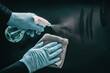 © Maridav - Cleaning surfaces as coronavirus infection spreading prevention. Clean surface hygiene in public spaces, offices, hospital for healthcare workers disinfecting home with medical PPE blue gloves.