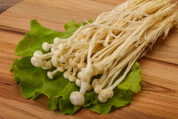 Raw Enoki mushrooms for cooking