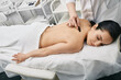 © Peakstock - Brunette woman gets Chinese gouache massage for body detoxify