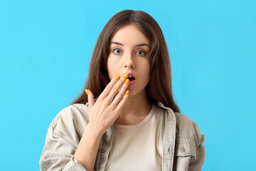 Wall Mural - Young woman with beautiful manicure on color background