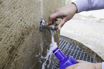 Man filling a water bottle