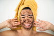 © Alessandro Biascioli - Young  woman applying coffee scrub mask on face - Happy girl having skin care spa day at home - Healthy alternative natural exfoliation treatment and youth people lifestyle concept