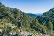 © zaizev - woman hiking on a mountain path in catalonia