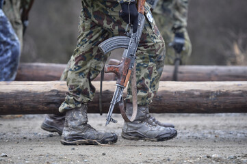 Special forces military training. Photograph detail with military equipment and assault rifle.