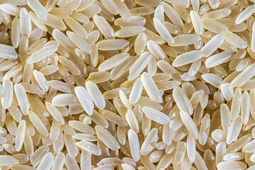 Wall Mural - White rice grains background or texture. Gluten-Free and healthy vegeterian food.