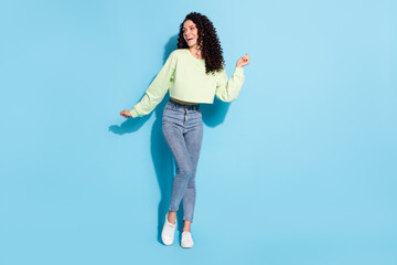 Poster - Photo of dreamy flirty lady have fun dance look empty space wear sweater jeans footwear isolated blue background