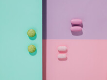 Trendy Pharmaceutical Layout Made With Medicine Pills, Tablets And Capsules On Multi Colored Background. Creative Medicine Concept. Minimal Flat Lay Style With Colorful Paper Backdrop.