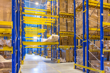 Wall Mural - Interior of a modern warehouse storage with rows and goods boxes on high shelves