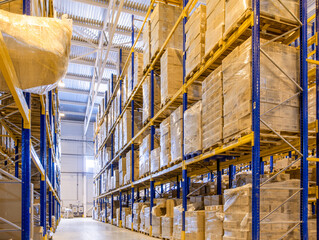 Wall Mural - Interior of a modern warehouse storage with rows and goods boxes on high shelves