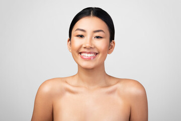 Pretty Korean Young Woman Smiling Posing Shirtless Over Gray Background