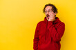 © Asier - Young caucasian man isolated on yellow background being shocked because of something she has seen.