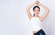 Portrait of beautiful young Asian sports fitness woman posing isolated over white wall background with copyspace for text. Sport And Healthy Lifestyle