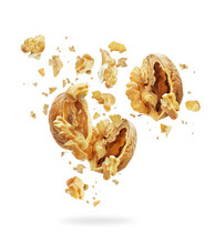 Walnuts Torn Into Pieces In The Air Isolated On White Background