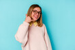 © Asier - Young student caucasian woman isolated on blue background showing a mobile phone call gesture with fingers.