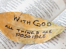 With God All Things Are Possible. Matthew 19:26 Bible New Testament Verse. Inspirational Passages From Scripture. Handwritten Text On A Leaf. Bible Concept.