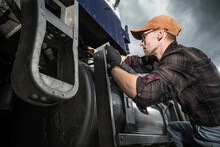 Semi Truck Driver Checking Vehicle Elements