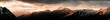 © Hofschulz & Schoppa - Alpenpanorama bei Sonnenaufgang auf dem Gipfel eines Berges