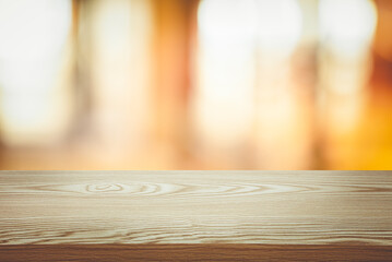 Wall Mural - Selective focus.Wood table top (Bar) with blur abstract light background