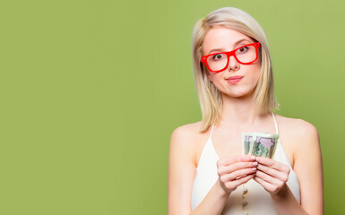 Canvas Print - Beautiful blonde girl in glasses with money