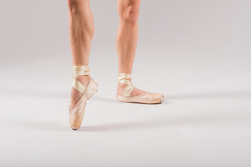 Feet close up of dancer isolated on white background.