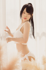 headshot portrait of young asian woman sexy girl with long hair using as background cosmetics woman 