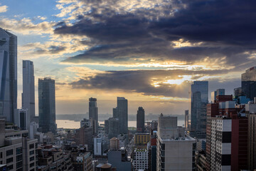 Wall Mural - New York city skyline. Aerial view of NY Manhattan skyscrapers, cloudy sky at sunset