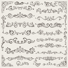 set of calligraphic design elements and page decorations. Elegant collection of hand drawn swirls and curls for your design. Isolated on beige background