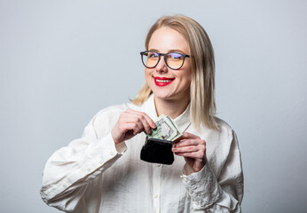 Canvas Print - Portrait of beautiful blonde in white shirt with money and wallet on white background