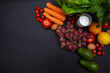 Selection of fresh vegetables and ingredients, flat lay photo on black background with copy space. Good for food intolerance and ibs management