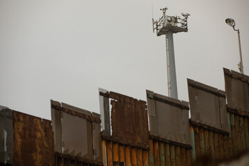 American border surveillance rises over the USA and Mexico border wall in Tijuana, Mexico.
