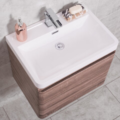 Sticker - High angle shot of a sink with wooden drawers in a bathroom