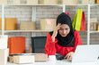 © godji10 - Stressed frustrated Muslim woman looks at the laptop are concerned about sales, Delay in delivery, Loss of money, Circulating capital problems