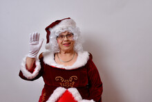 American Female Clause Smiling And Waving At The Camera