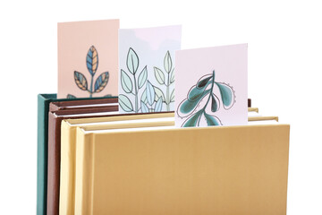 Books with bookmarks on white background, closeup