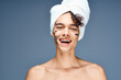 © SHOTPRIME STUDIO - man with bare shoulders black cream face mask clear skin