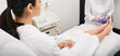 © Peakstock - Laser treatment of onychomycosis. Woman gets laser treatment fungal infection on toenail and onychomycosis treatment with a medical laser