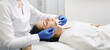 © Peakstock - Brunette woman gets mechanical cleansing facial skin from defects and removing blackhead at a medical clinic