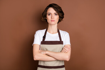 Sticker - Photo of serious charming person folded arms look attentively camera isolated on brown color background