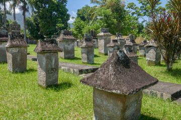 Wall Mural - View of traditional Minahasa stone tombs known as waruga in ancient Airmadidi cemetery, North Sulawesi, Indonesia