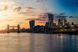 Fototapeta  - Sunset to night seamless view to the modern skyline of London, United Kingdom, with Tower Bridge and the City
