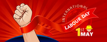 International Labour Day With A Victorious Fist And A Red Background.