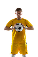 Wall Mural - Portrait of young soccer football player posing isolated on white background.