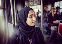 Middle Eastern Girl Riding Public Transport In The City