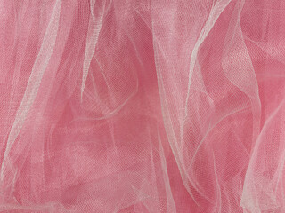 Wall Mural - Pink tulle fabric texture top view. Coral background. Fashion rose color trendy feminine tutu skirt flat lay, female blog glossy backdrop for text sign design. Girly abstract wallpaper,textile surface