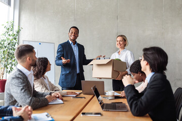 Wall Mural - African HR Manager Introducing New Employee To Colleagues In Office