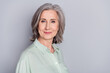 © deagreez - Photo of happy smiling good looking mature businesswoman wear green shirt isolated on grey color background